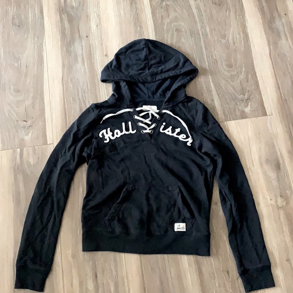 navy blue Hollister hoodie with tied up v-neck